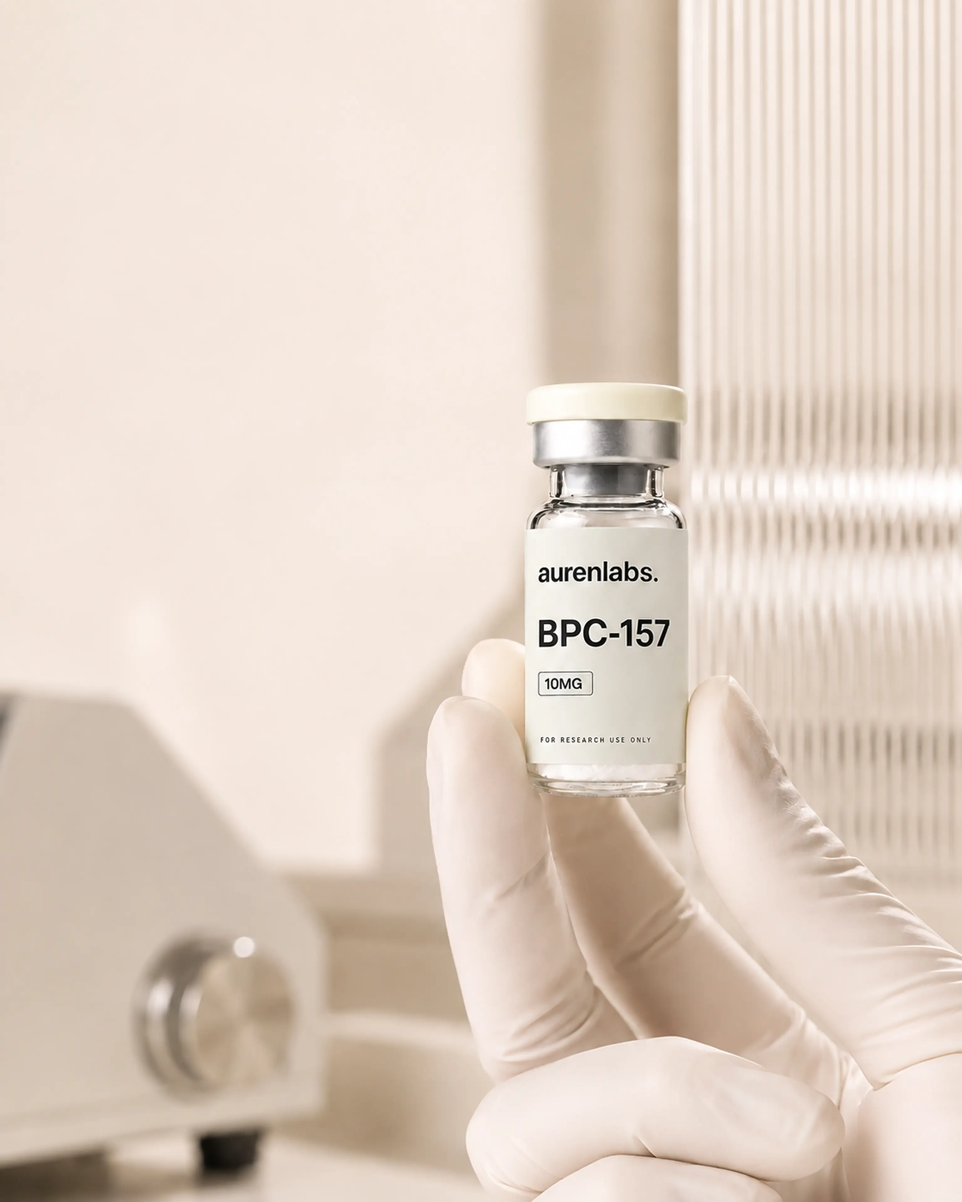 Auren Labs research vial handled carefully in a laboratory setting